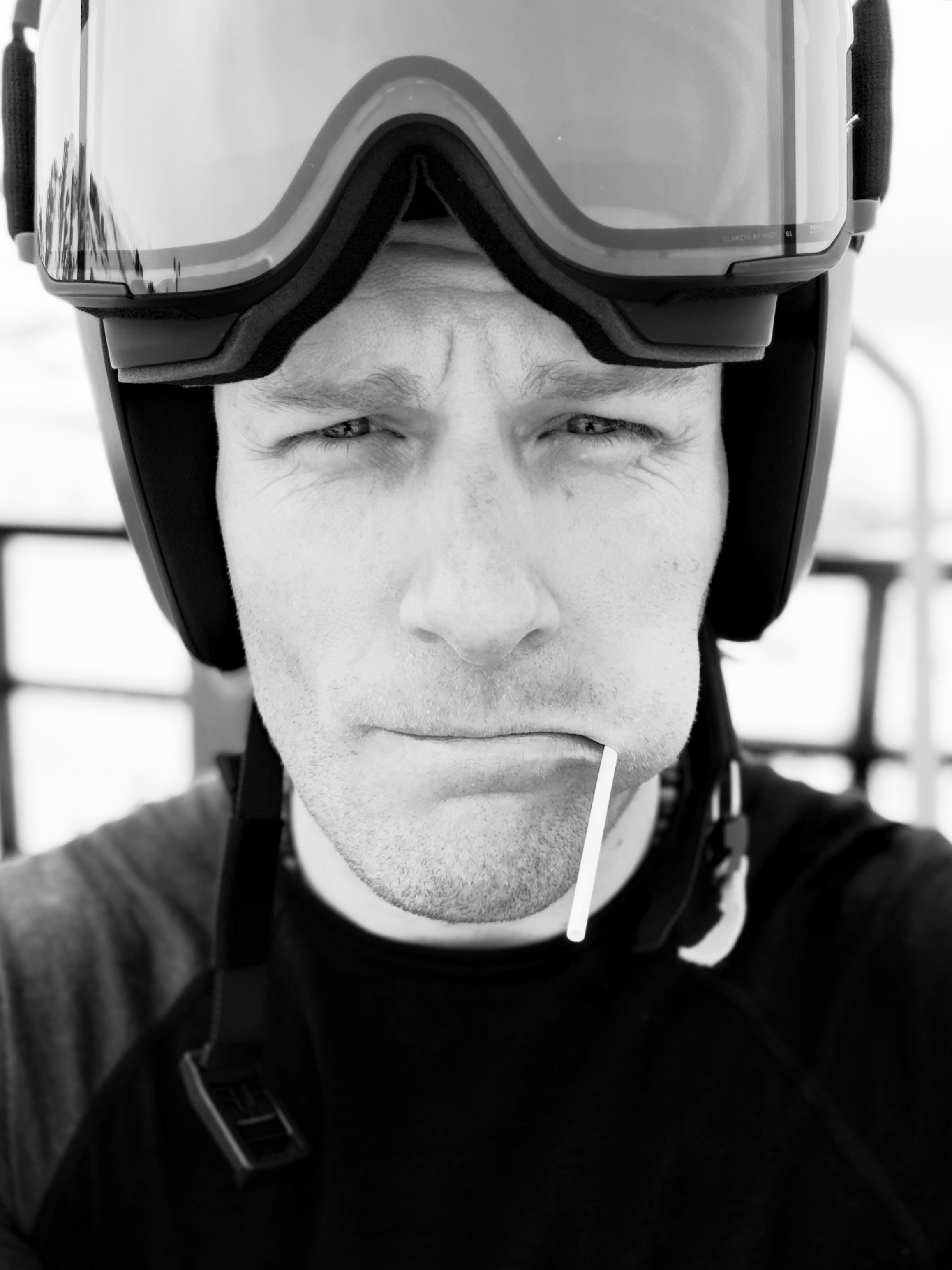 Black-and-white portrait in ski helmet and goggles